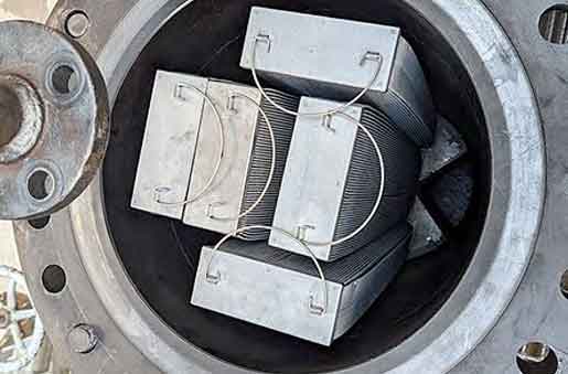 Open filter vessel showing Invicta trapezoidal cartridges packed inside — refinery hydrocracker application